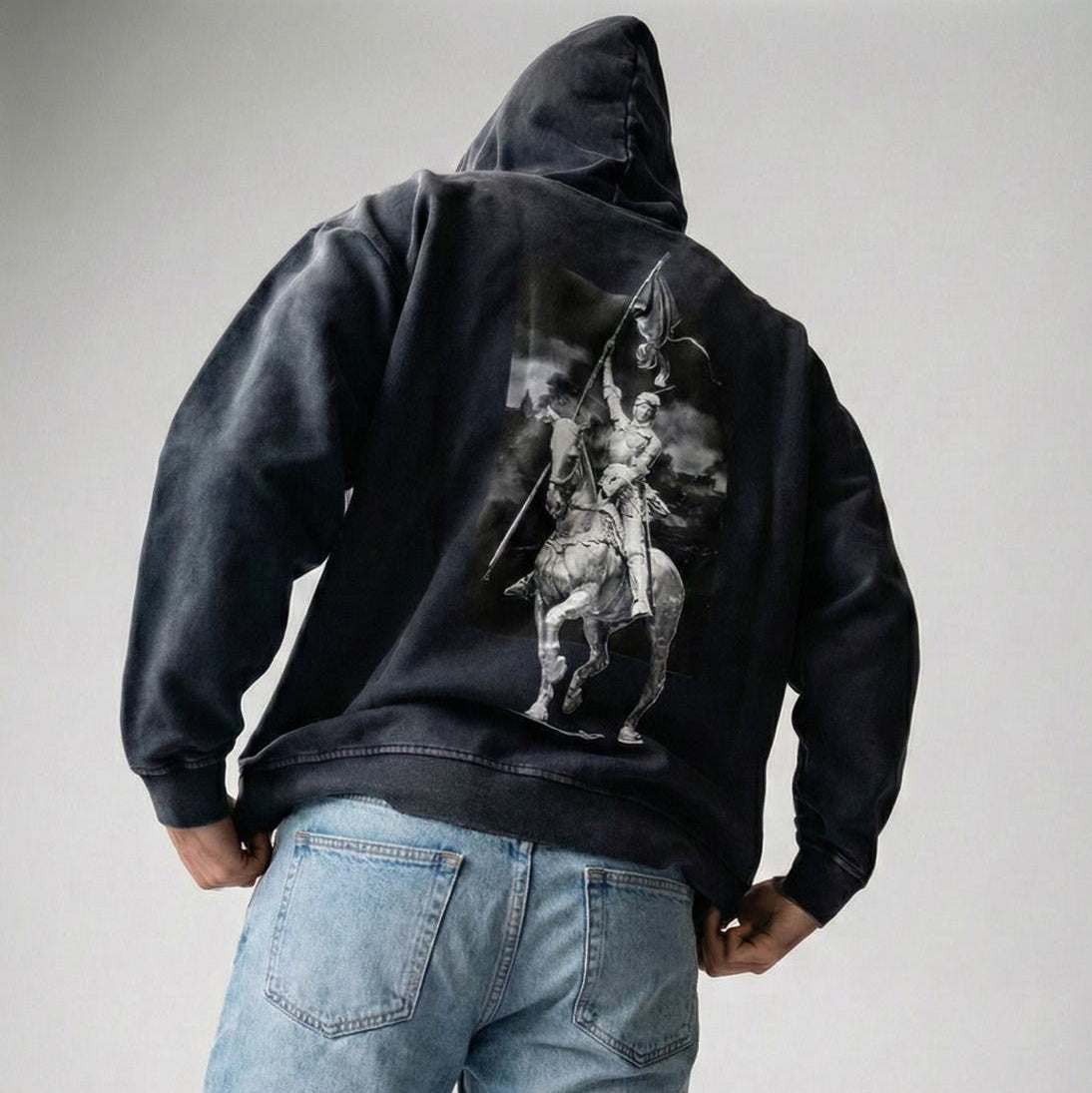 Black hoodie representing Jeanne d'Arc in a battlfield